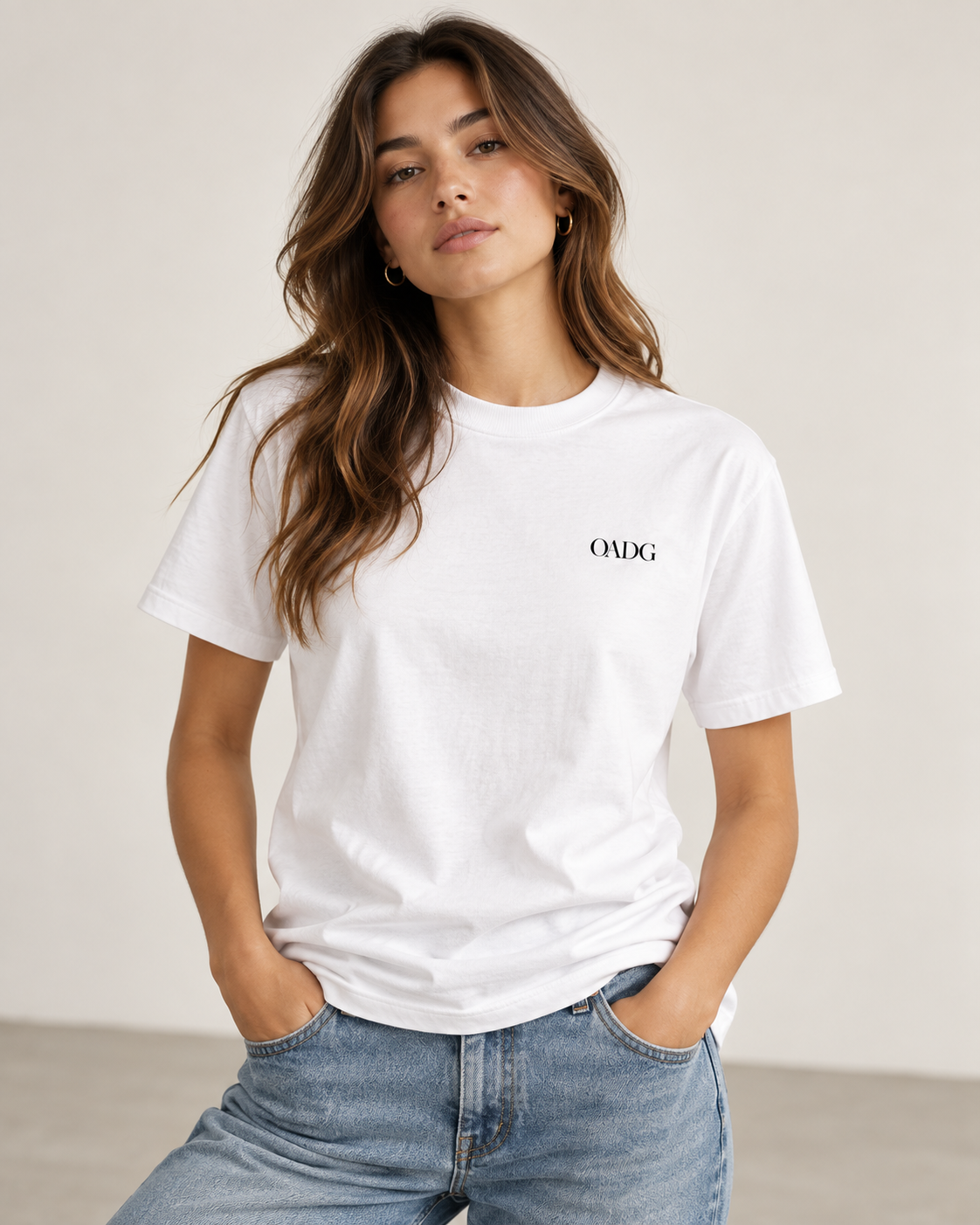Model wearing a white OADG tee